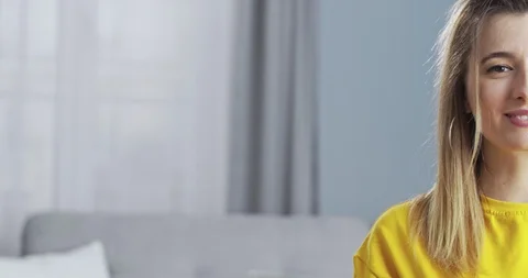 Close up front portrait half face of adorable, young tender blonde girl smiling Stock Footage 129936756