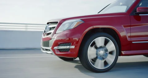 Close on front red Mercedes crossover SUV over bridge Stock Footage 137067690