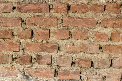 Close-up front shot of orange colored masonry brick wall texture Stock-Fotos
