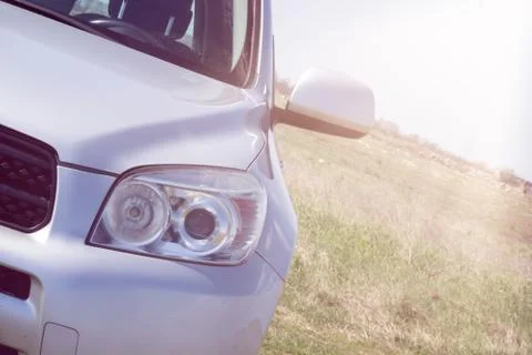 Close up front vew silver SUV car out of the road. Detail of a modern car. He Stock Photos