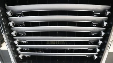 Close-up front view of an air cooler louver vent with horizontal adjustable.. Stock Photos