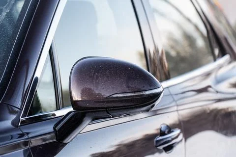 Close up front view of car side mirror. Front rear view mirror on the car win Stock Photos