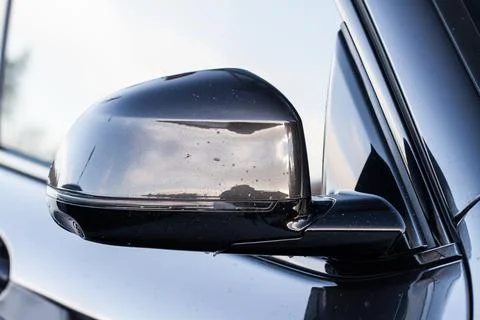 Close up front view of car side mirror. Front rear view mirror on the car win Stock Photos