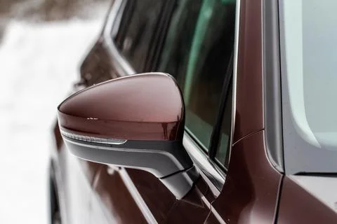 Close up front view of car side mirror. Front rear view mirror on the car win Stock Photos