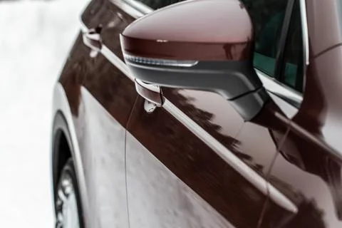 Close up front view of car side mirror. Front rear view mirror on the car win Stock Photos