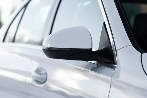 Close up front view of car side mirror. Front rear view mirror on the car win Stock Photos