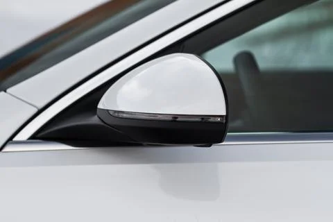 Close up front view of car side mirror. Front rear view mirror on the car win Stock Photos