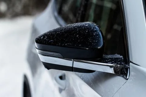 Close up front view of car side mirror. Front rear view mirror on the car win Stock Photos
