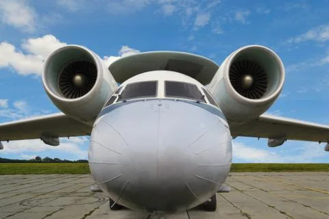 Close-up in front view of a jet plane with turbojet engines and radar antenna Stock Photos