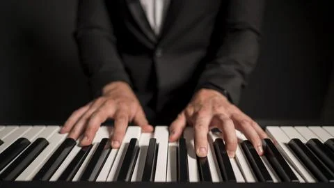 Close up front view professional keyboard player Stock Photos