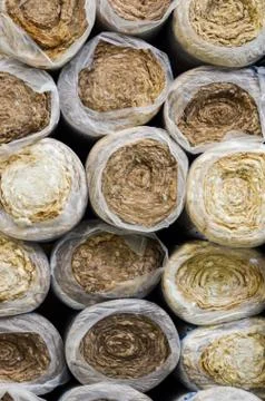 Close up  front view of  round basalt mineral wool packages  in plastic foil Stock Photos