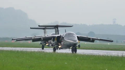 Close-up front view of two historic military jet planes taxiing on the runway Stock Footage 159751598