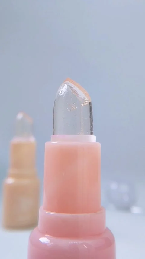Close up front view of two lip balm products neatly arranged on a white pod.. Stock Footage 340260665