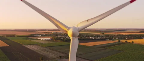 Close up Front view Wind turbine spinning blades. Slow camera zoom out Video stock 245288912