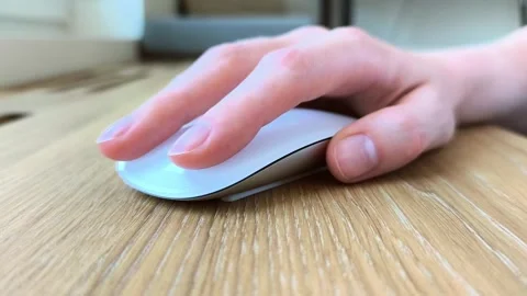 Close-up front view of a woman's finger on a mouse. Female hand clicking an.. Stock Footage 340283624
