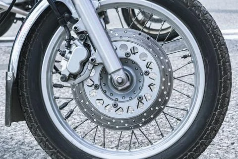 Close-up of the front wheel of a motorcycle Stock Photos
