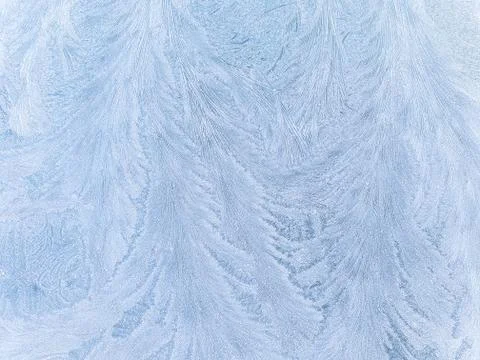 Close up of frost patterns on a window screen Stock Photos