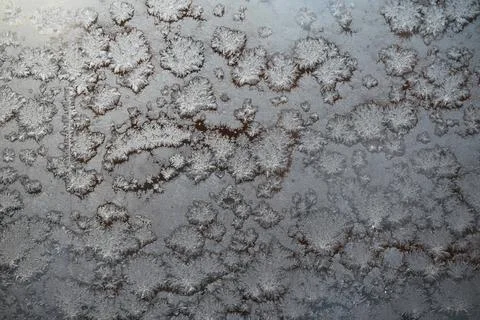 Close-Up of Frost Patterns on a Windowpane During Winter Morning Stock Photos