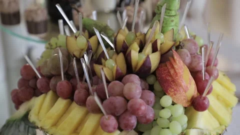 A close-up of a fruit platter on a buffet table, where everything looks Stock Footage 321697637