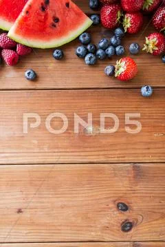 Close up of fruits and berries on wooden table Stock Photos