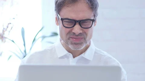 Close Up of Frustrated Middle Aged Man with Loss Working on Laptop Stock Footage 88114322
