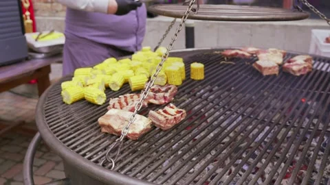 Close-up of frying corn and ribs on barbecue Stock Footage 171915720