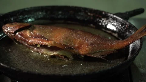 Close Up of Frying Fish in a Cooking Pan Stock Footage 236609557