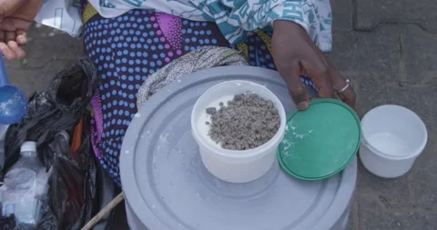 Close up of Fulani woman's hands making Fura da nono Stock Footage 259470008