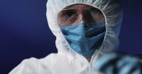 Close up of full equipped and protected medic in medical mask and goggles Stock Footage 135195898