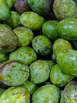 Close Up Full Frame Background of Fresh Green Unripe Mangoes Stock Photos