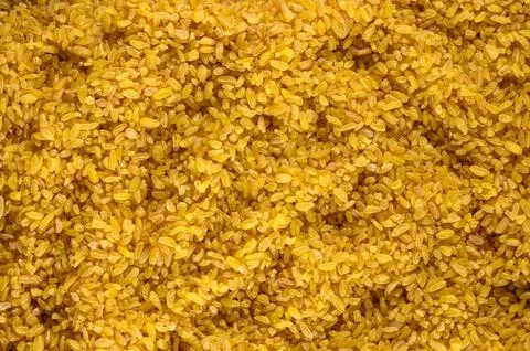 Close-up full frame background of raw bulgur wheat grains Stock Photos