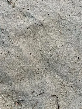Close up full frame background texture of fine dry sand on a coastal beach Stockfoto's