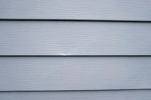 Close-up full-frame shot of light gray horizontal plastic or vinyl house siding Stock Photos