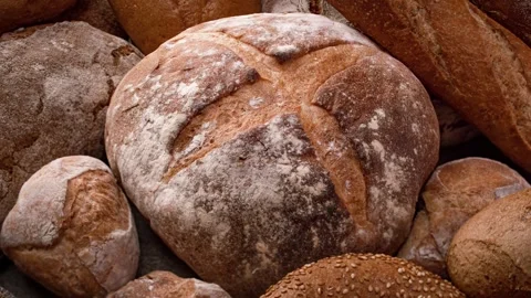 Close up full frame shot of various freshly baked bread and pastries, a lar.. Stock Footage 337358560