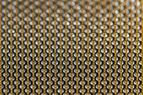 Close-up full frame view of gold plated microprocessor pin array. Abstract Stock Photos