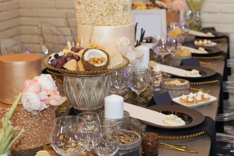 Close up of a fully set banquet table with brown and earth tones Stock Photos