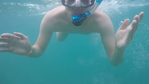 Close-up of funny and happy man swimming underwater wearing a mask Stock Footage 85801943