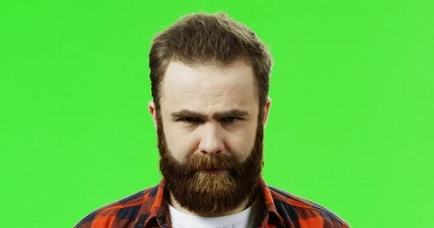 Close up of the funny man with a beard having fun and moving his eyebrows on the 스톡 동영상 90363430