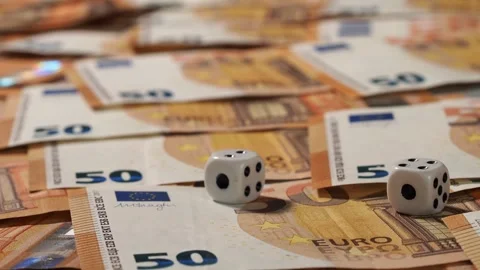 Close-up of a game board for the game on which banknotes of 50 euros lie, dice a Stock Footage 247571340