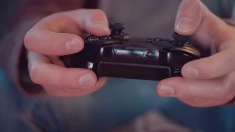Close-up of a game console in the hands of a gamer Stock-Footage 82277873