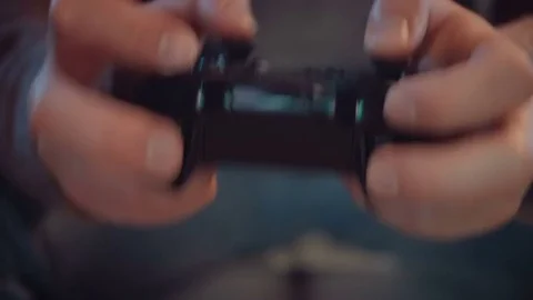 Close-up of the game console in the hands of the player 4K resolution Video stock 82382972