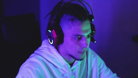 Close-up of gamer guy wearing headset with microphone Vídeos de archivo 144369530