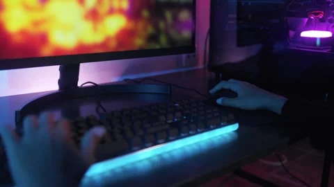 Close-up of gamer hands playing strategy video game online inside gaming room Stock Footage 260908091