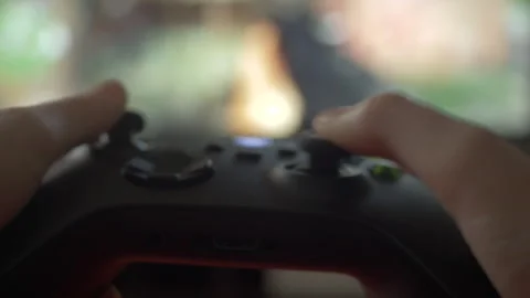 Close-up of Gamer Hands Playing Video Game on Console Using Joystick. Child.. 库存影片 327367928