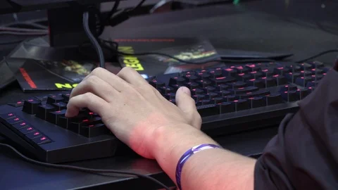 Close-up of gamer with keyboard testing video games Stock Footage 91797949