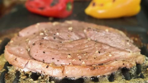 Close-up, gammon steak cooking on the grill with vegetables, 4K Stock Footage 132464599