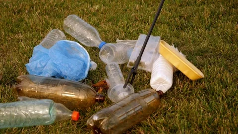 Close-up of a garbage collection tongs with a plastic bottle in the city. Stock Footage 315380666