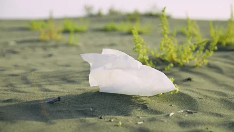 Close-up of garbage lying on the beach. Beach pollution. Ecological problem. Video stock 320717345