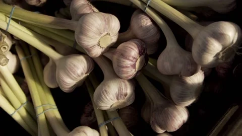 Close-up of garlic bouquets laying in boxes Stock Footage 146141287