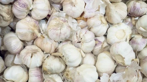 Close-up of garlic on a store counter. man chooses garlic Video stock 139350734